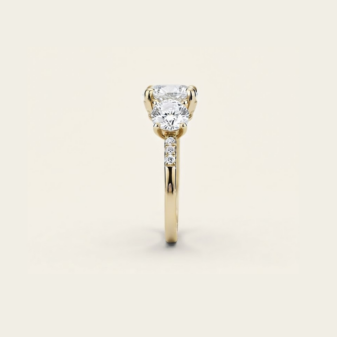 Side profile of the Celia Ring in gold, showing the raised prong setting and pavé accents along the band.

variant: yellow-gold