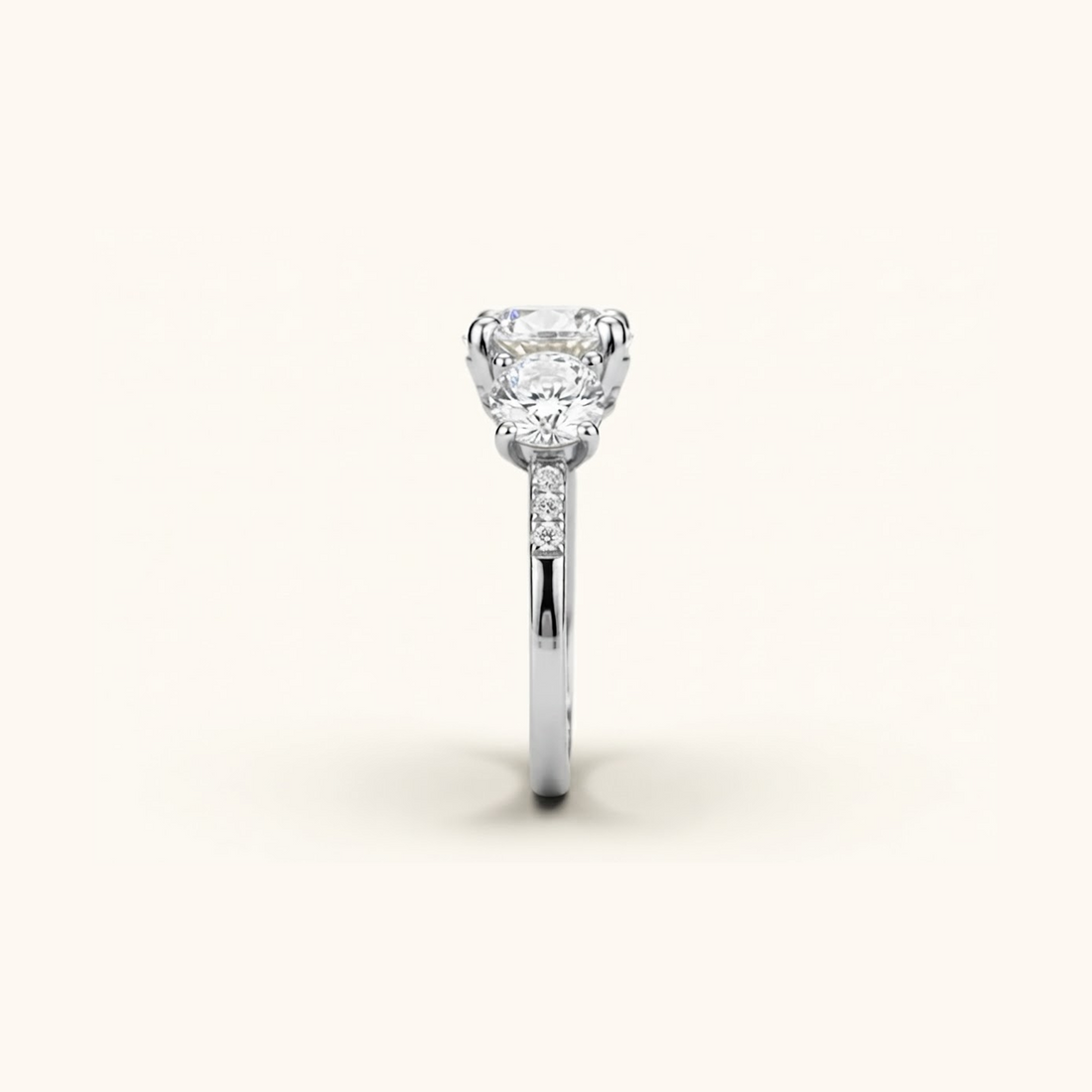 Side profile of the Celia Ring in silver or platinum, showing the raised prong setting and pavé accents along the band.

variant: silver