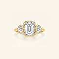 Clio Three-Stone ring in 14K yellow gold with a bezel-set emerald-cut lab diamond between two oval side stones
variant: yellow-gold