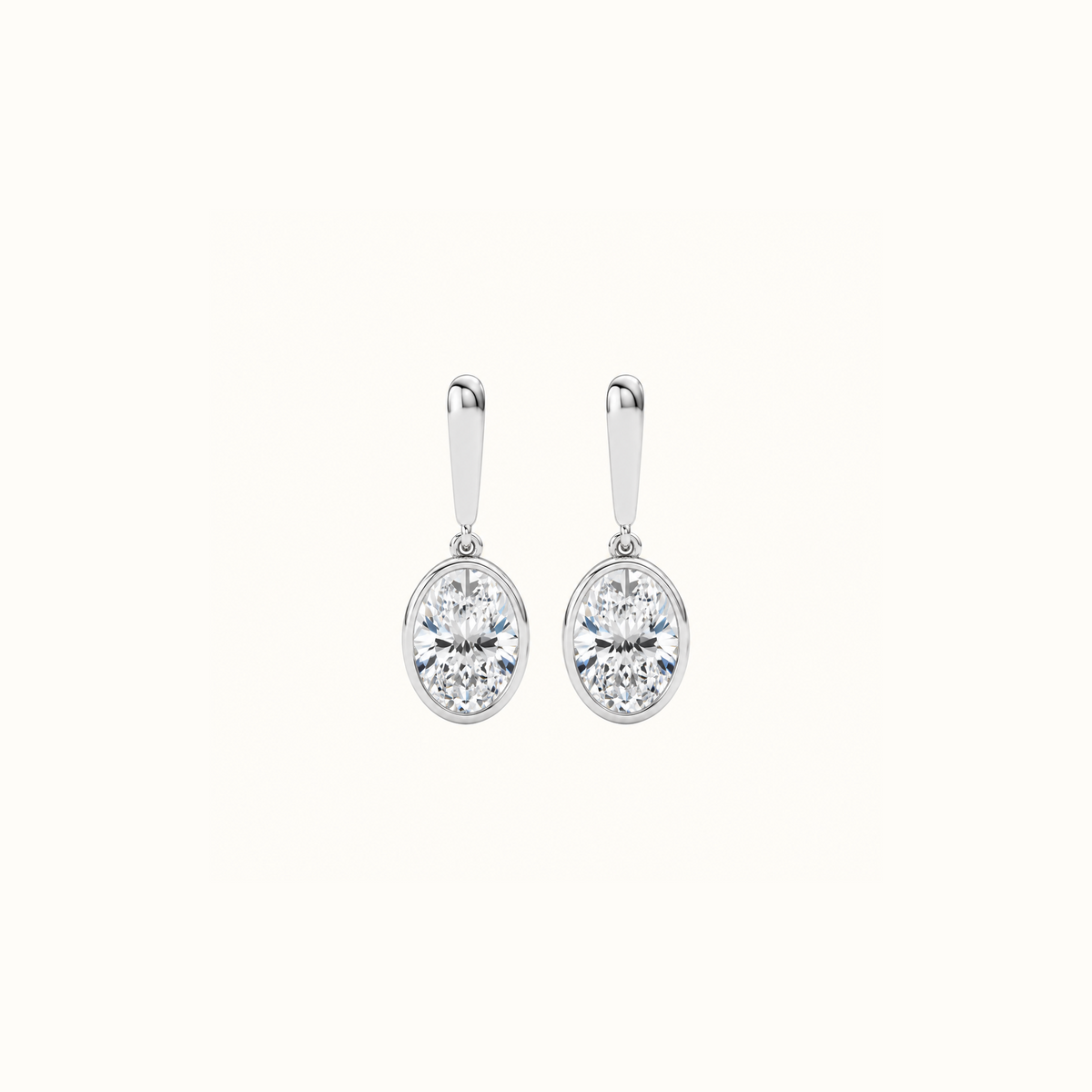 Droplet Earrings in 14K white gold, a pair of oval lab diamonds in smooth bezels hanging from polished gold bars
variant: white-gold