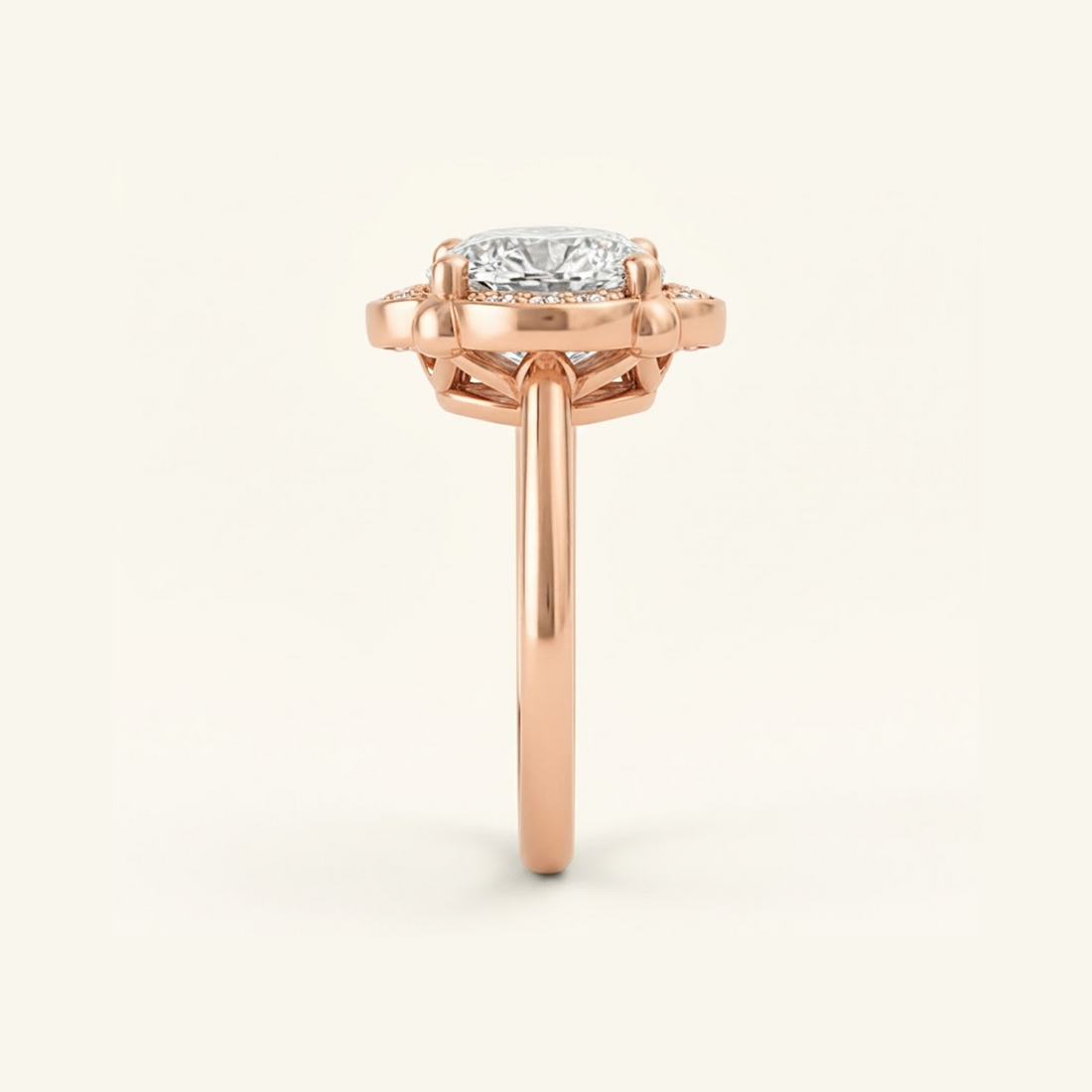 Side profile of the Elise Ring in rose gold, showing the scalloped halo, open gallery beneath the stone, and smooth band.

variant: rose-gold