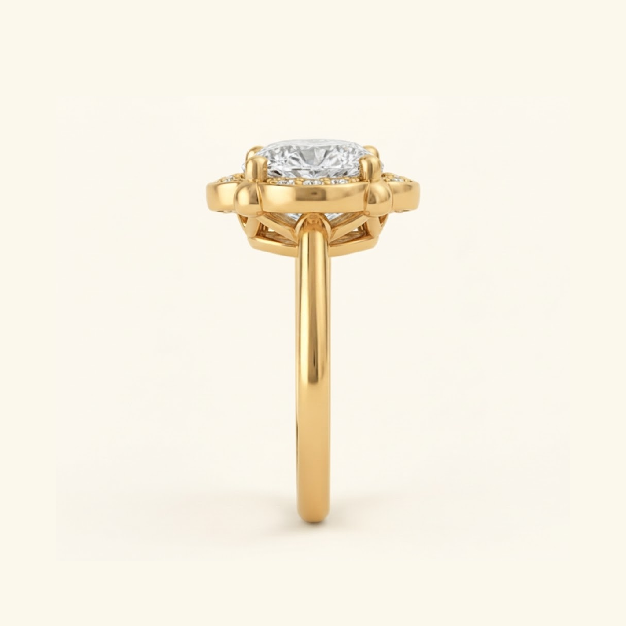 Side profile of the Elise Ring in yellow gold, showing the scalloped halo, open gallery beneath the stone, and smooth band.

variant: yellow-gold