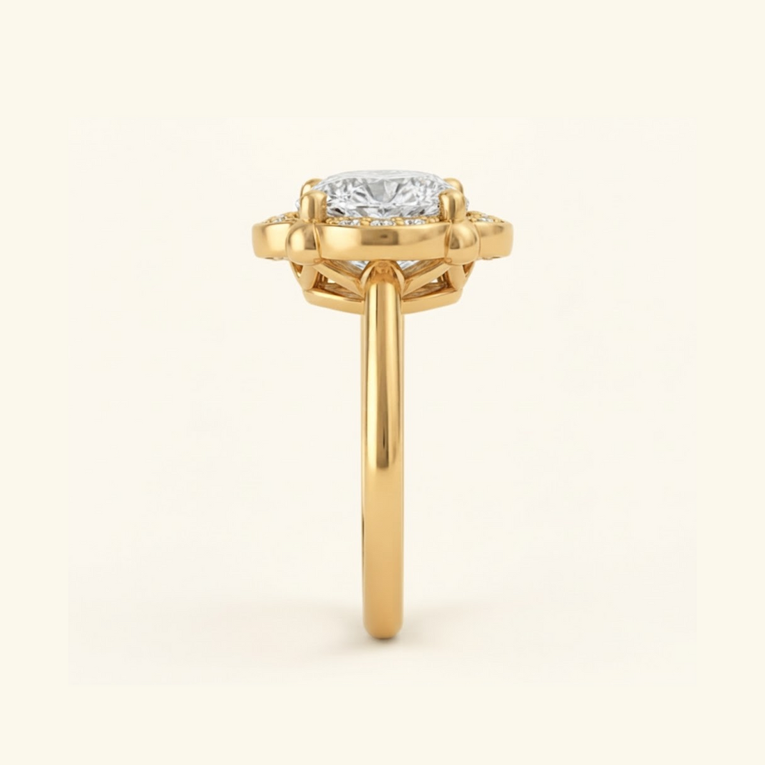 Side profile of the Elise Ring in yellow gold, showing the scalloped halo, open gallery beneath the stone, and smooth band.

variant: yellow-gold