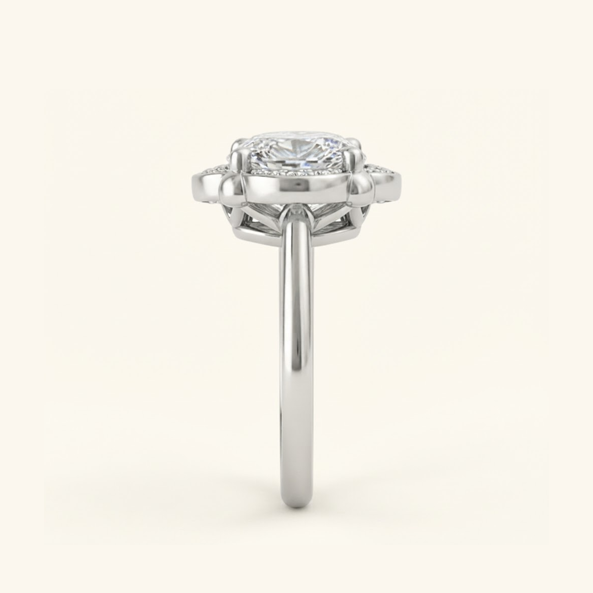 Side profile of the Elise Ring in silver or platinum, showing the scalloped halo, open gallery beneath the stone, and smooth band.

variant: silver