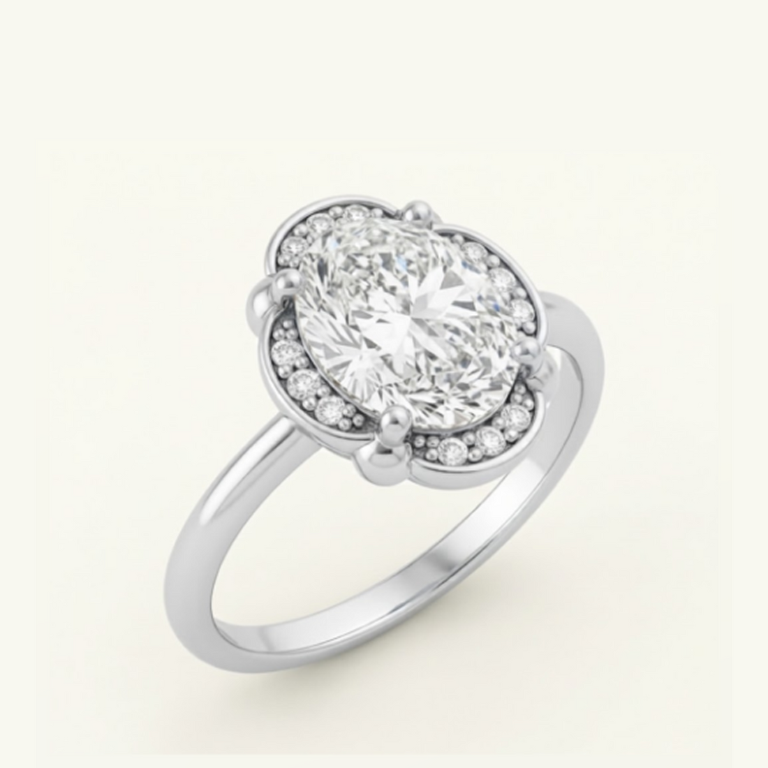 Elise Ring in silver at an angle, showing the oval center diamond, scalloped diamond halo, and slim polished band.

variant: silver