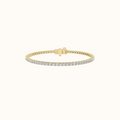 Everly tennis bracelet in yellow gold with a continuous row of round diamonds and a hidden box clasp, on a cream background
variant: yellow-gold