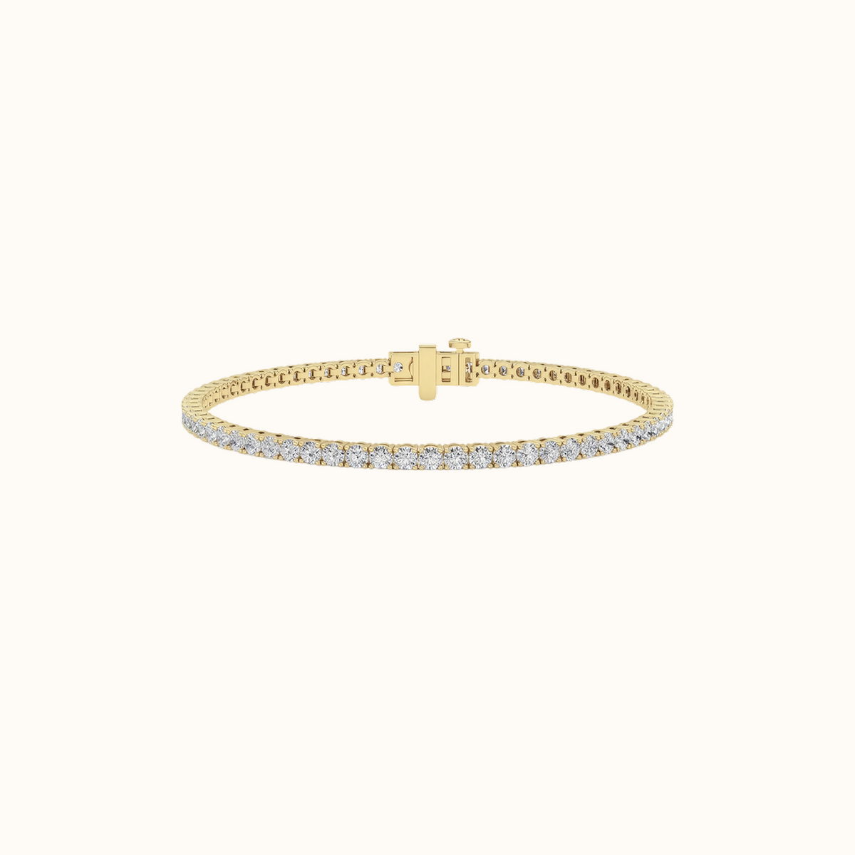 Everly tennis bracelet in yellow gold with a continuous row of round diamonds and a hidden box clasp, on a cream background
variant: yellow-gold