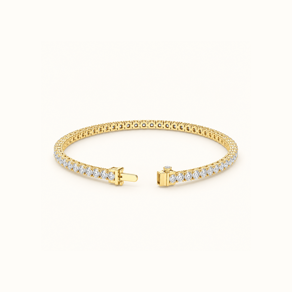 Everly tennis bracelet in yellow gold laid in an open curve, showing the unbroken line of round diamonds from above
variant: yellow-gold