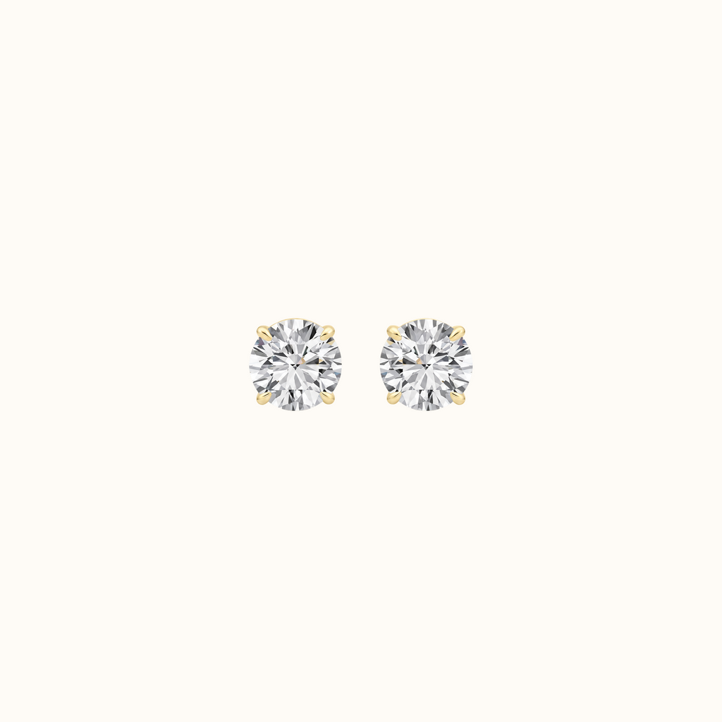 Everly round brilliant diamond stud earrings in 14K yellow gold, pair shown front-facing on cream
variant: yellow-gold