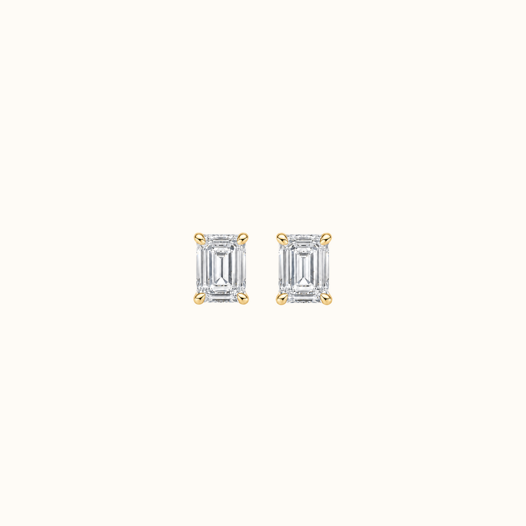 Everly emerald brilliant diamond stud earrings in 14K yellow gold, pair shown front-facing on cream
variant: yellow-gold