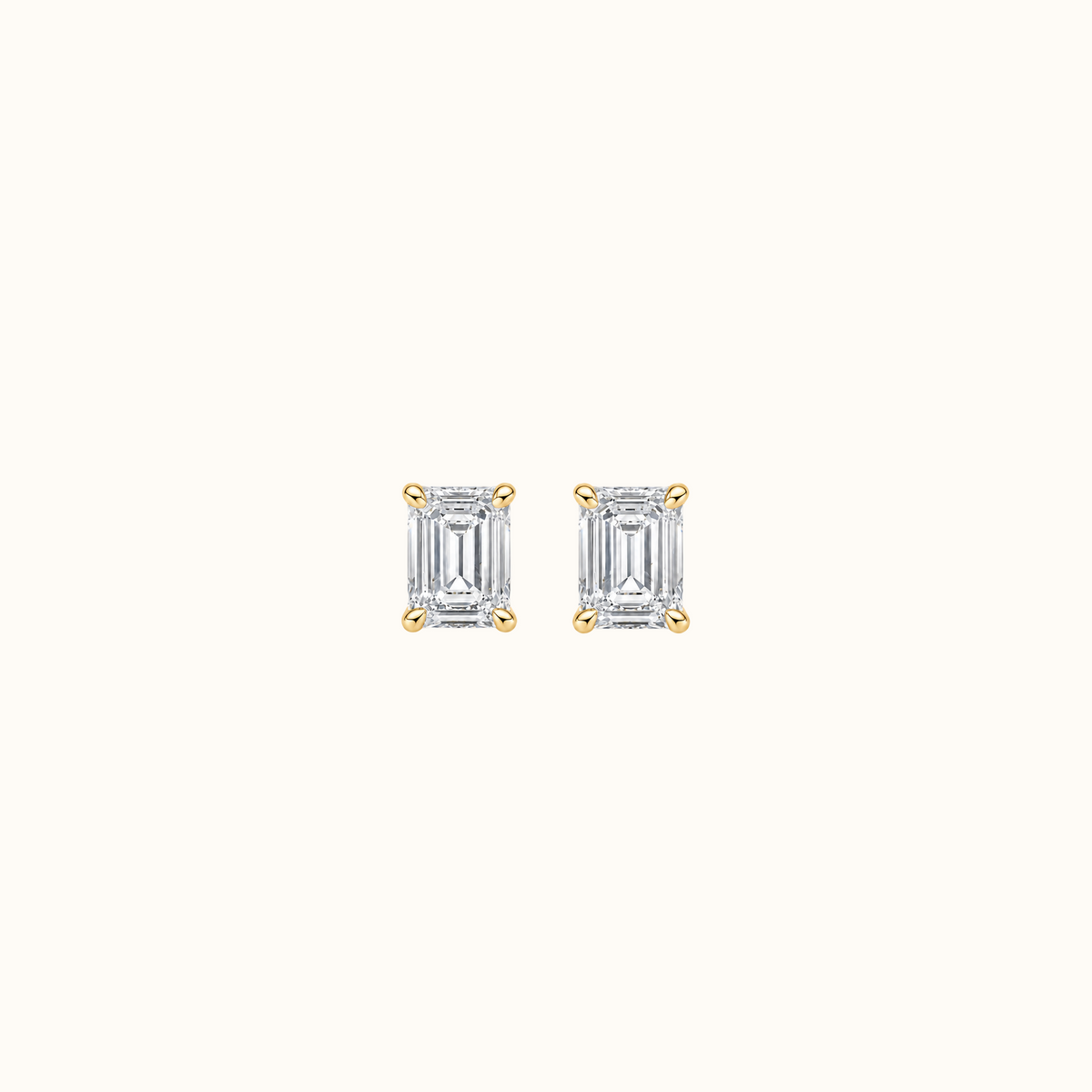 Everly emerald brilliant diamond stud earrings in 14K yellow gold, pair shown front-facing on cream
variant: yellow-gold