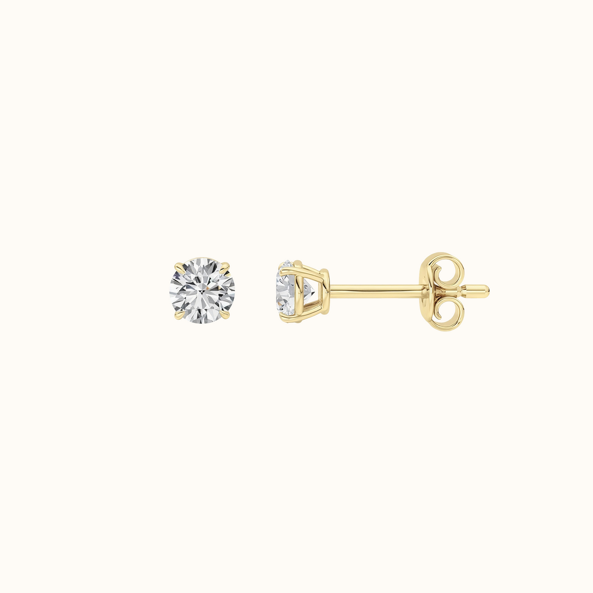 Everly round brilliant diamond stud earrings in 14K yellow gold, pair shown front-facing on cream
variant: yellow-gold