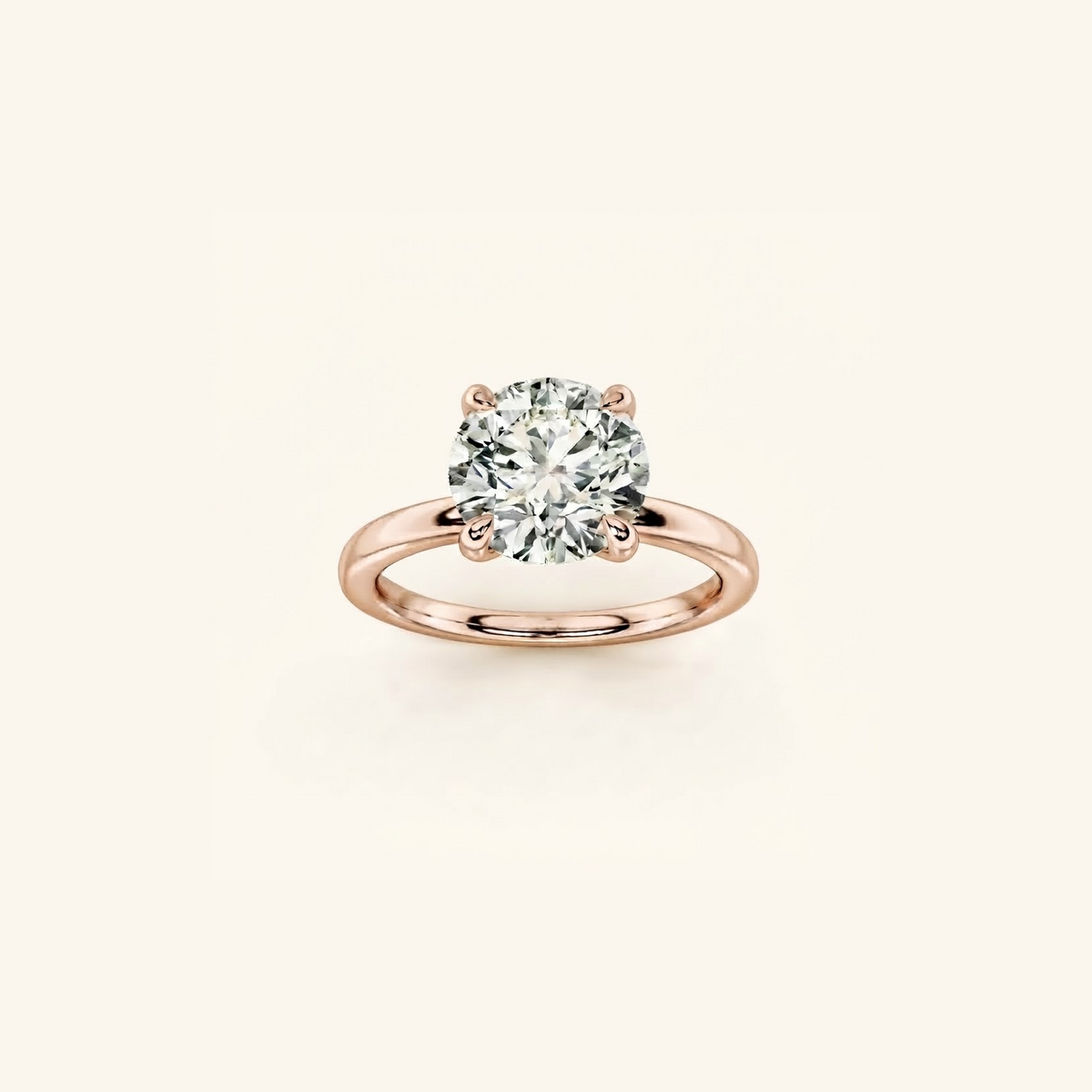 Everly solitaire engagement ring in rose gold with a 1ct round diamond in a four-prong setting, on a cream background
variant: rose-gold
