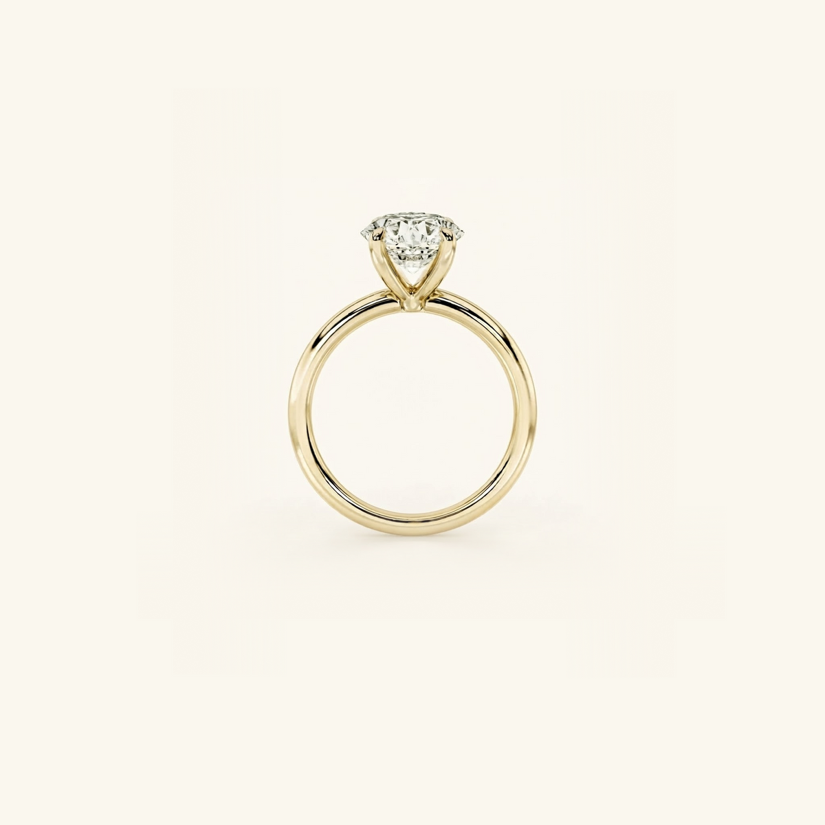Everly solitaire ring in yellow gold seen edge-on, showing the band’s profile and the height of the four-prong setting
variant: yellow-gold