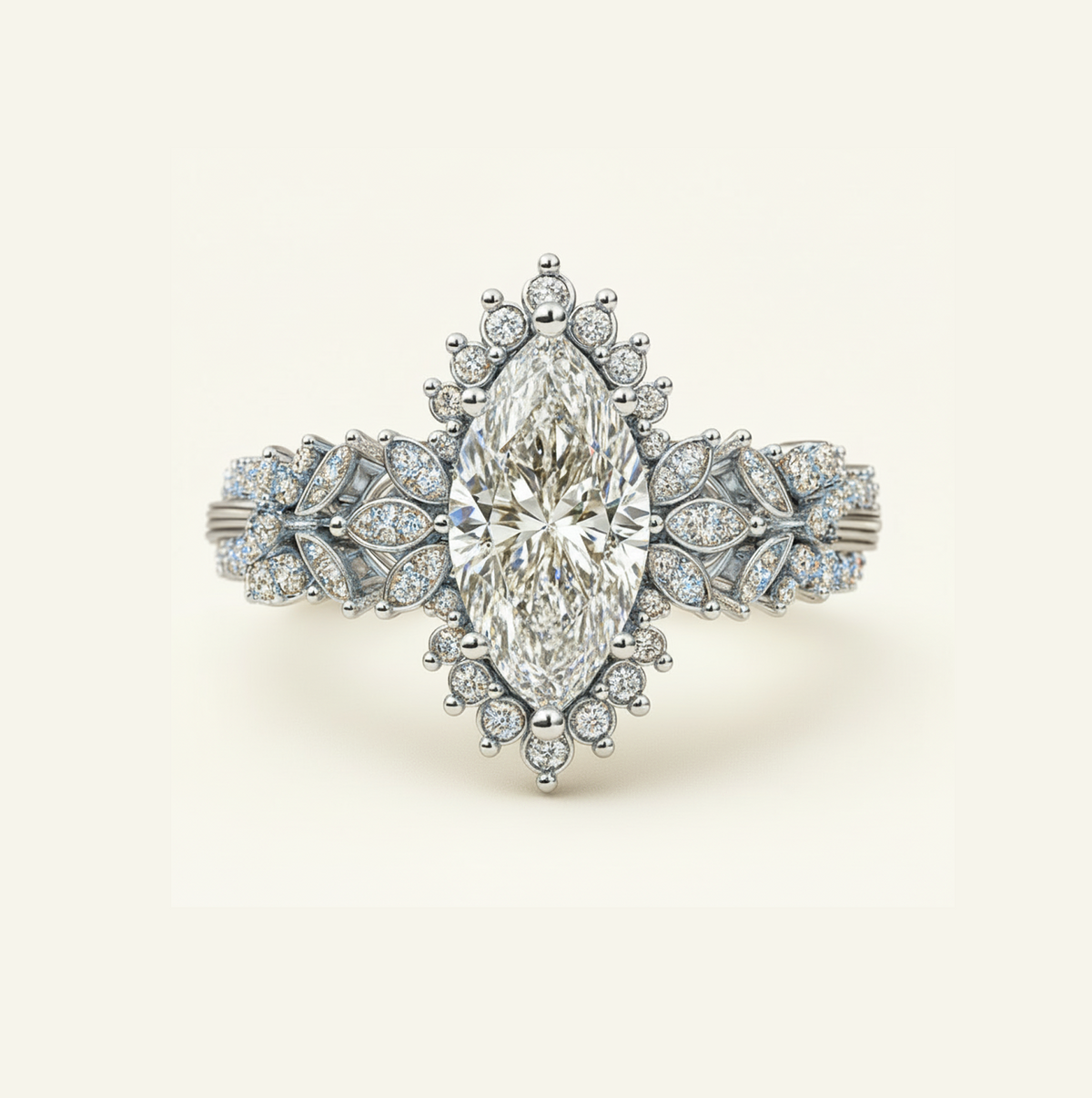 Flora Ring in silver with a marquise center diamond, starburst diamond halo, and leaf-inspired pavé band, on a cream background.
variant: silver