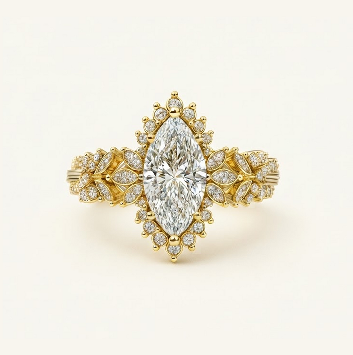 Flora Ring in yellow gold with a marquise center diamond, starburst diamond halo, and leaf-inspired pavé band, on a cream background.
variant: yellow-gold