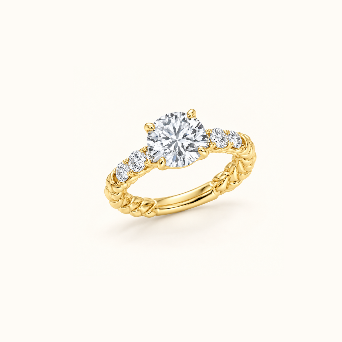 Juliette Solitaire engagement ring in 14K yellow gold at an angle, showing pavé diamonds along the twisted rope band
variant: yellow-gold