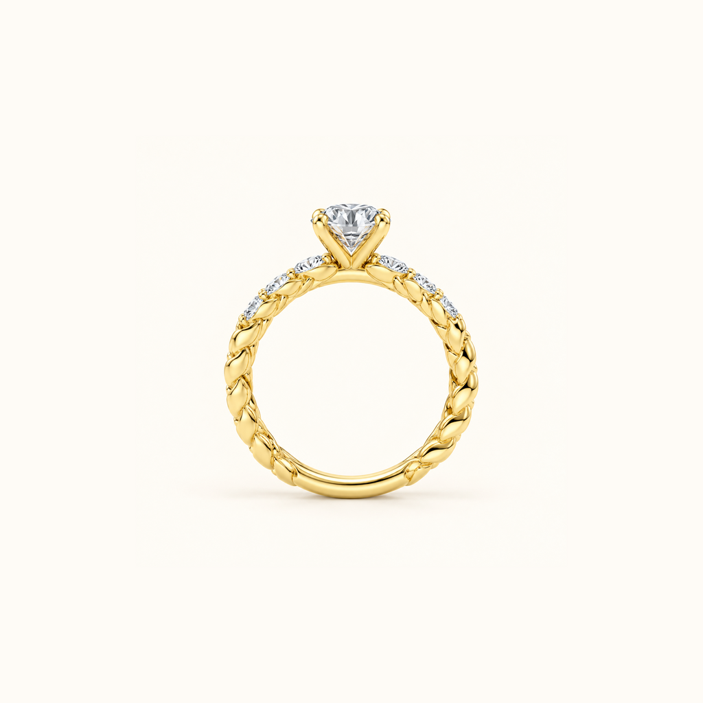 Juliette Solitaire engagement ring in 14K yellow gold standing upright, showing the rope twist all the way around the band
variant: yellow-gold