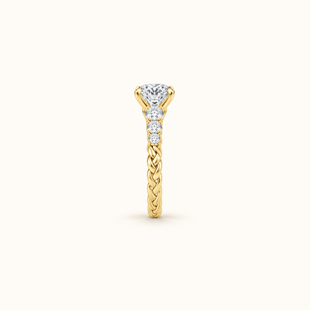 Side profile of the Juliette Solitaire engagement ring in 14K yellow gold, showing the raised prong setting
variant: yellow-gold