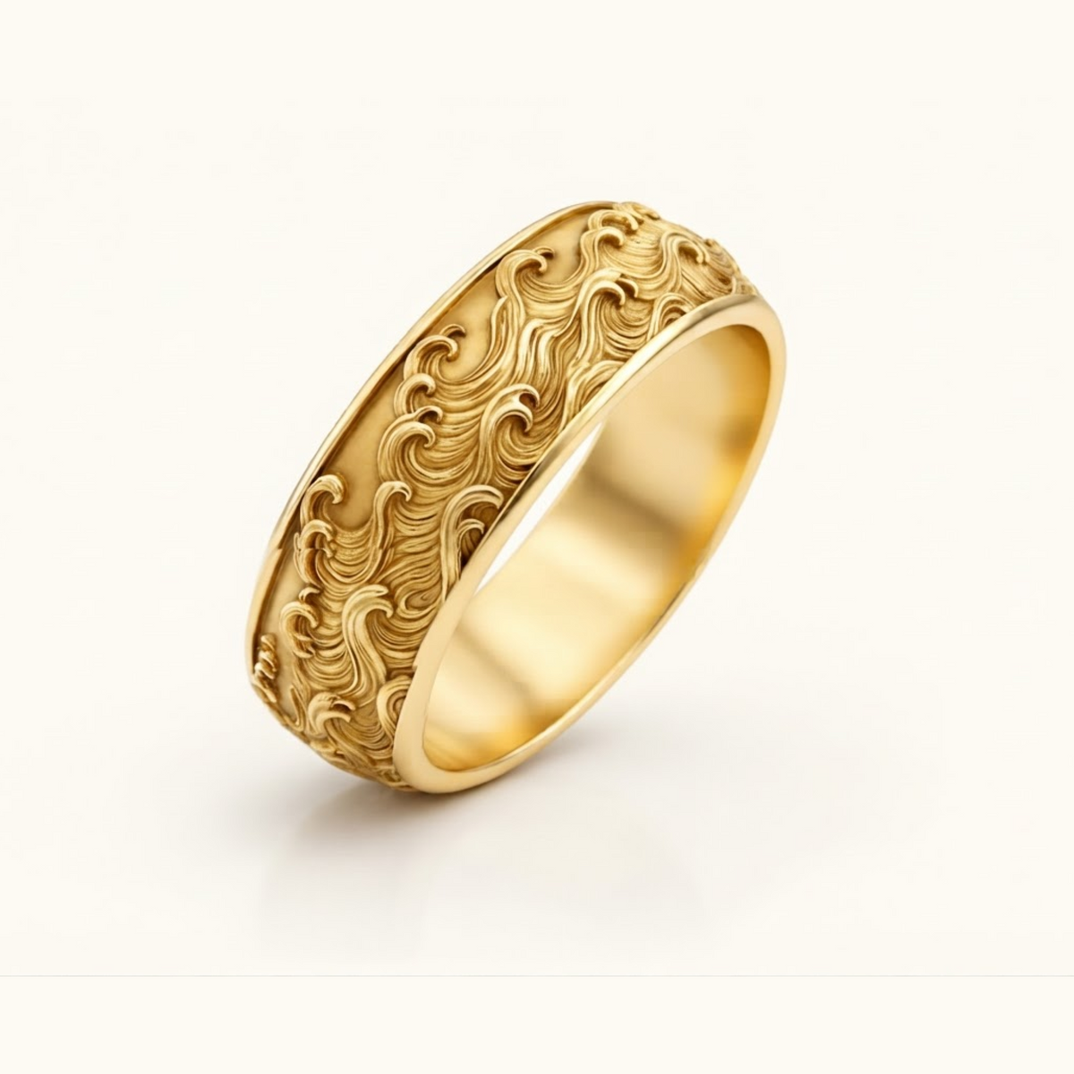 Kai Ring in yellow gold at an angle, showing the carved wave pattern and smooth polished interior.
variant: yellow-gold