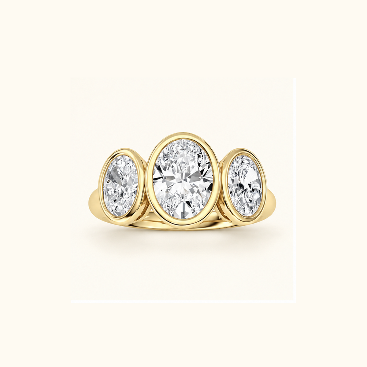 Luna Dome Ring in 14K yellow gold with three bezel-set oval lab diamonds in a row, the center stone largest
variant: yellow-gold