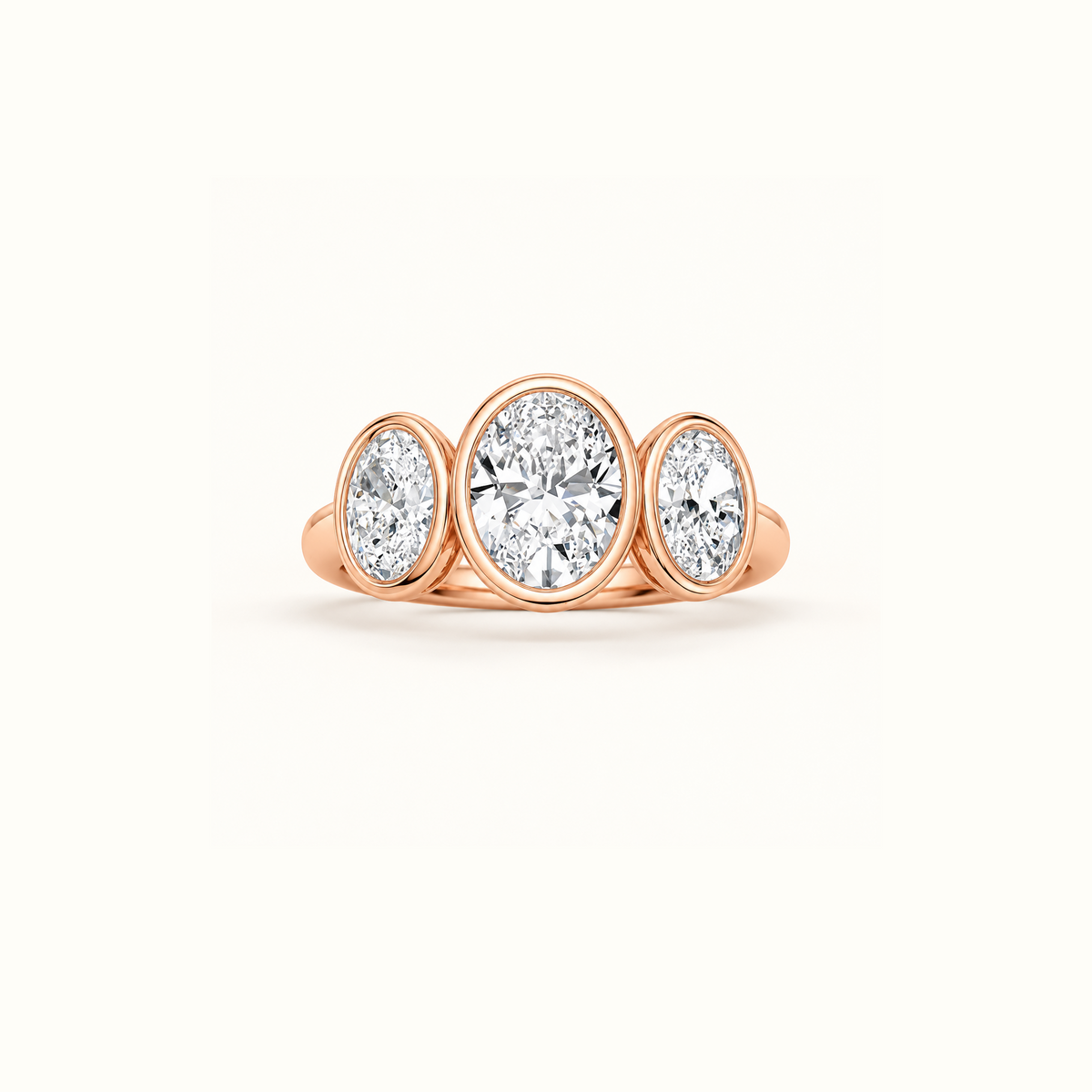 Luna Dome Ring in 14K rose gold with three bezel-set oval lab diamonds in a row, the center stone largest
variant: rose-gold