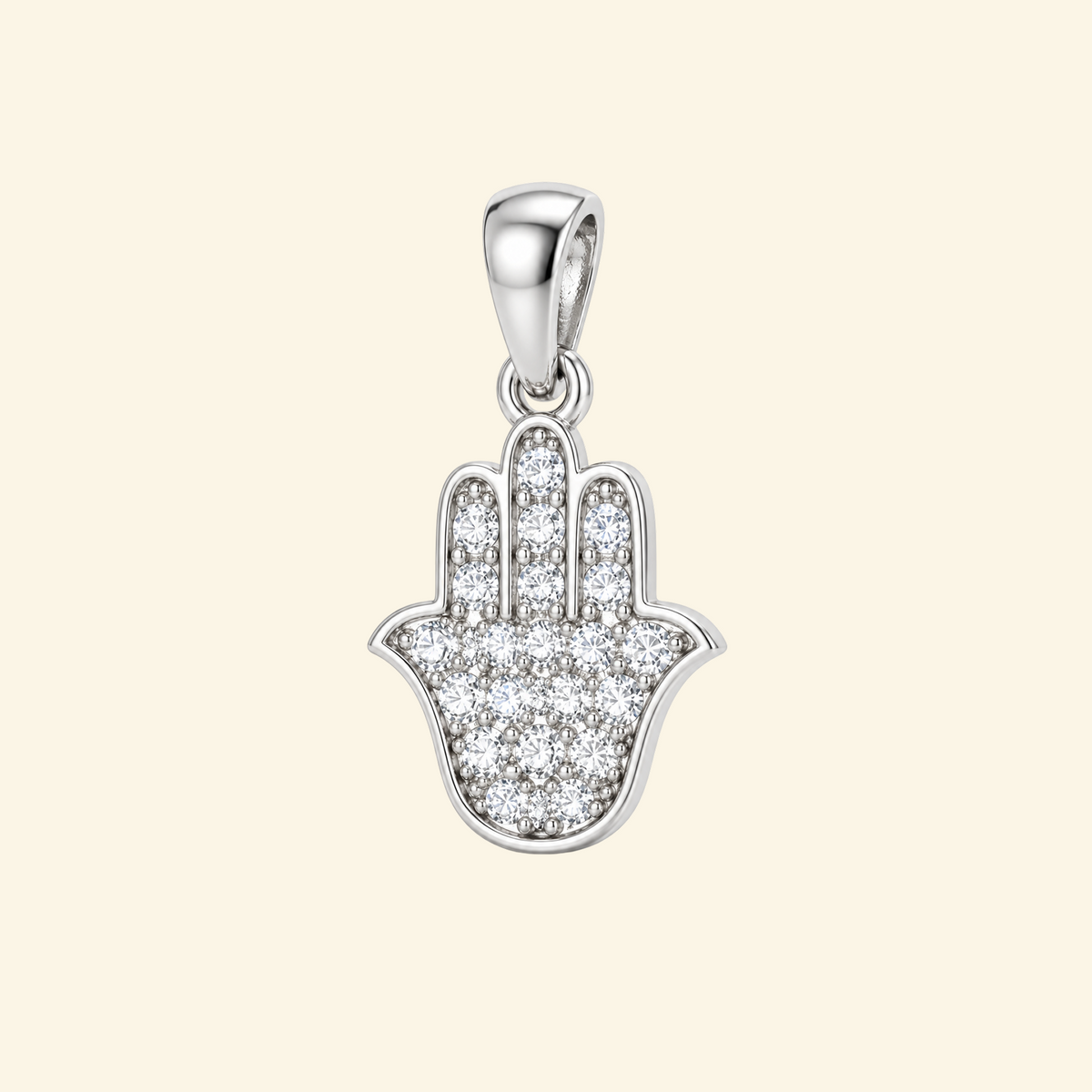 Close-up of the Mira pendant in silver a hamsa hand fully set with pavé stones and a polished rim.
variant: silver