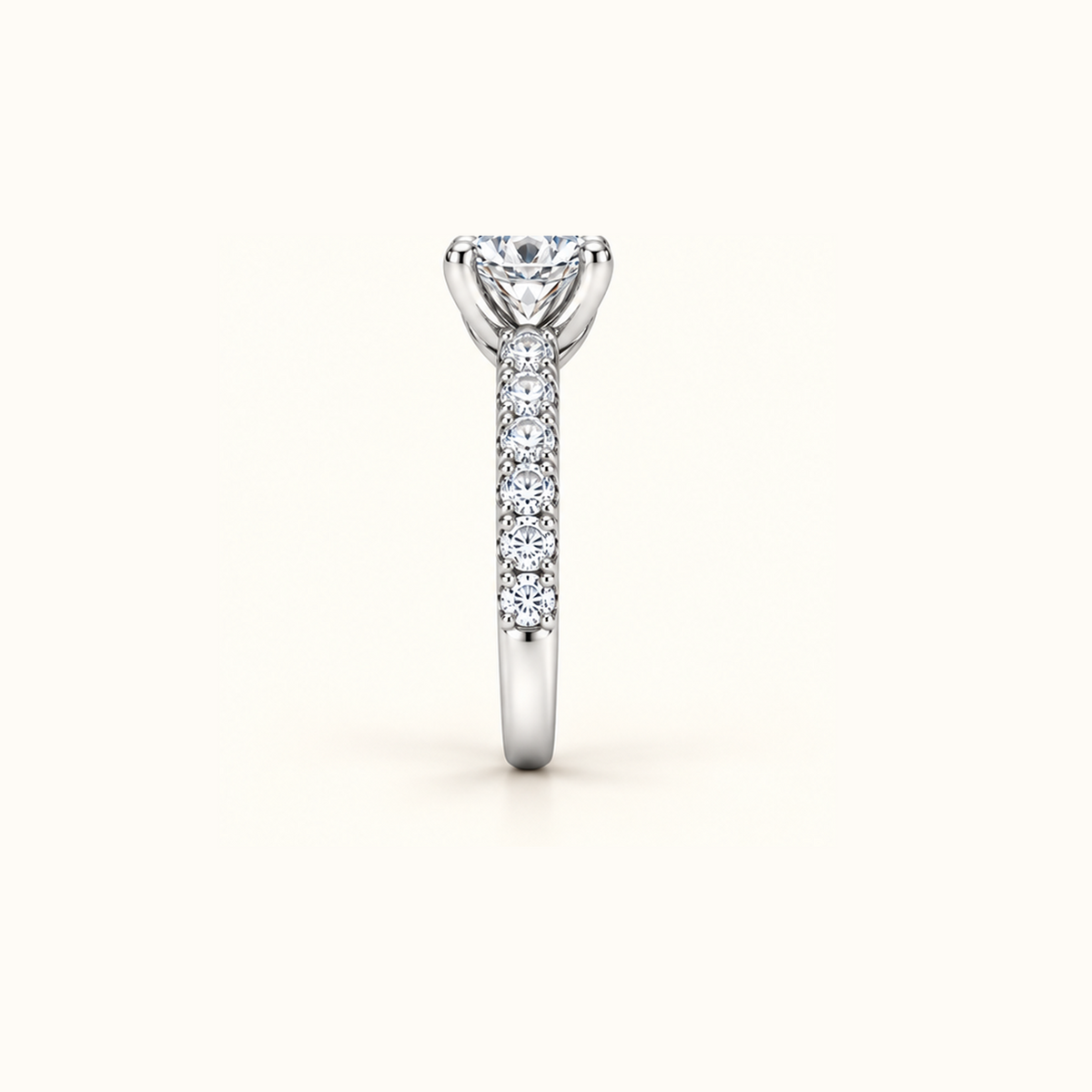 Noelle ring in white gold from the front, showing the lifted four-prong setting above the band
variant: white-gold