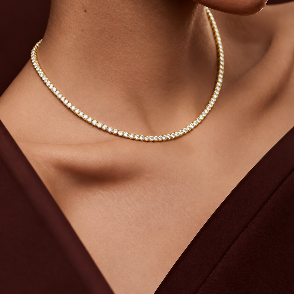 Orbit Riviera tennis necklace in 14K yellow gold worn at the collarbone, a continuous line of bezel-set diamonds
variant: yellow-gold