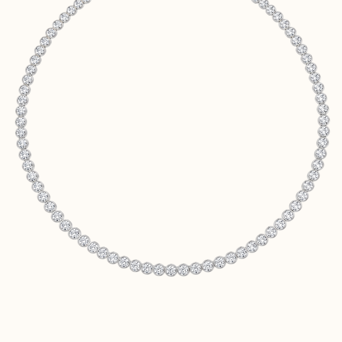 Orbit Riviera tennis necklace in 14K white gold laid in a full circle, round lab diamonds each set in a smooth bezel
variant: white-gold