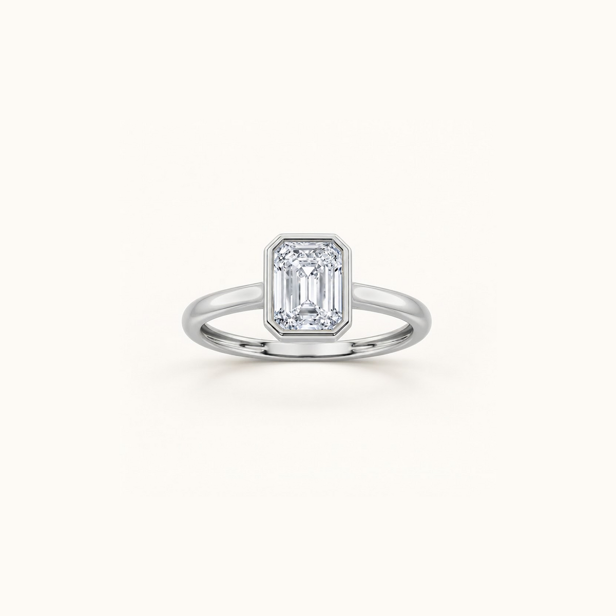 Orbit ring in 14K white gold with a 1ct emerald diamond in a smooth bezel setting
variant: white-gold