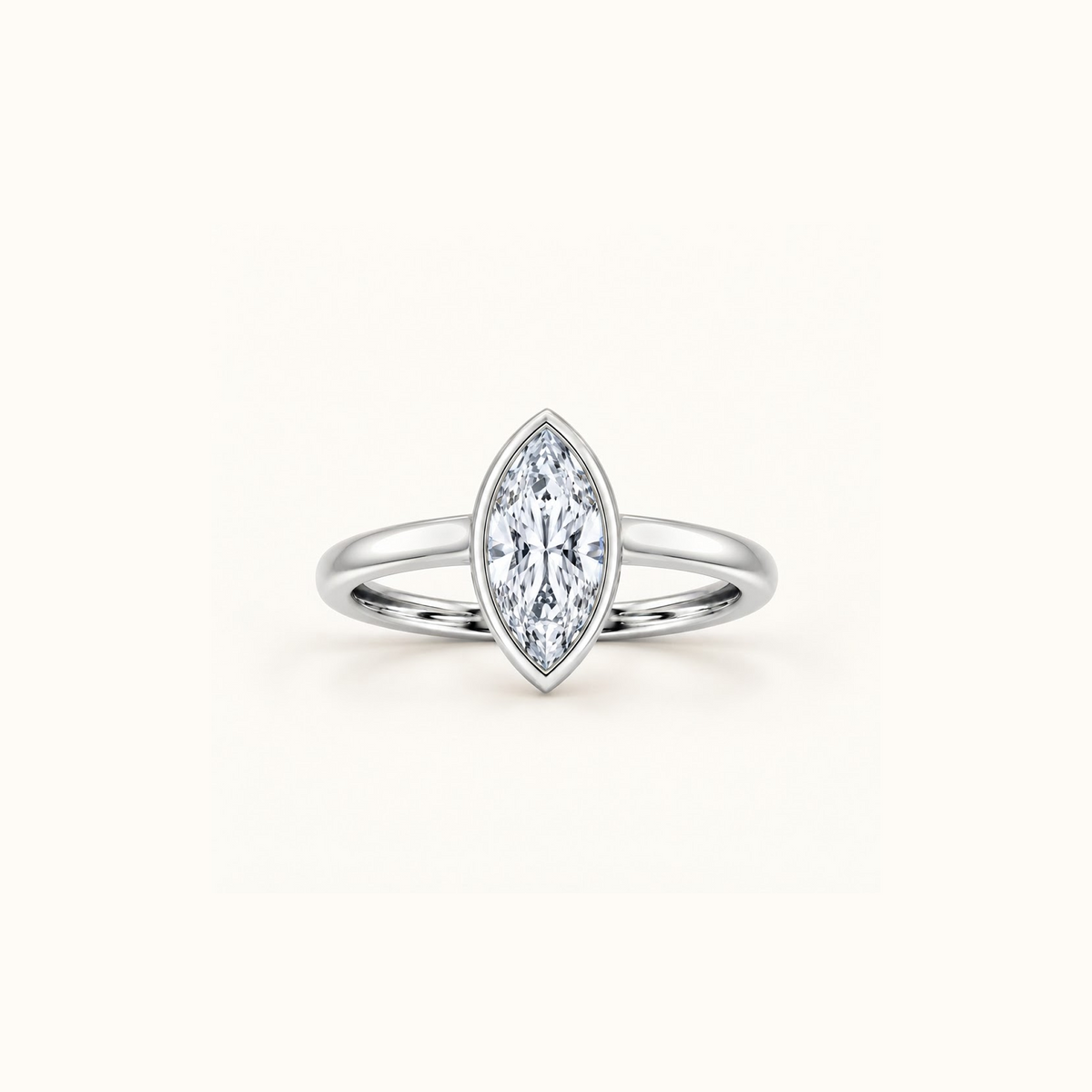 Orbit ring in 14K white gold with a 1ct marquise diamond in a smooth bezel setting
variant: white-gold
