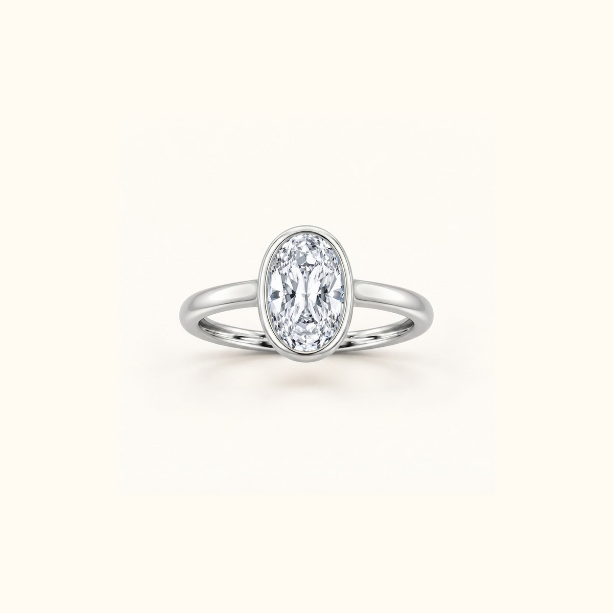 Orbit ring in 14K white gold with a 1ct oval diamond in a smooth bezel setting
variant: white-gold