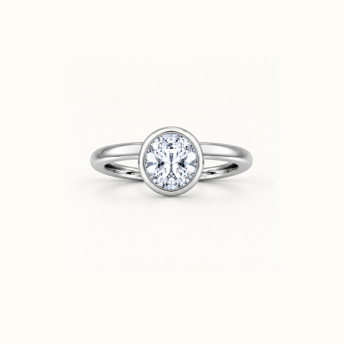 Orbit ring in 14K white gold with a 1ct round diamond in a smooth bezel setting
variant: white-gold