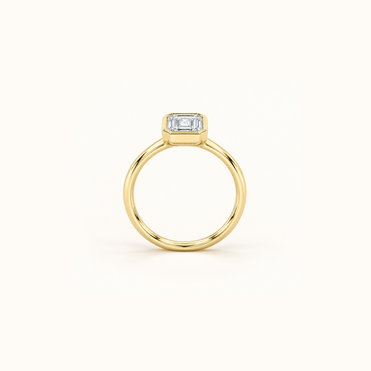 Edged view of Orbit ring in 14K yellow gold with a 1ct emerald diamond in a smooth bezel setting
variant: yellow-gold