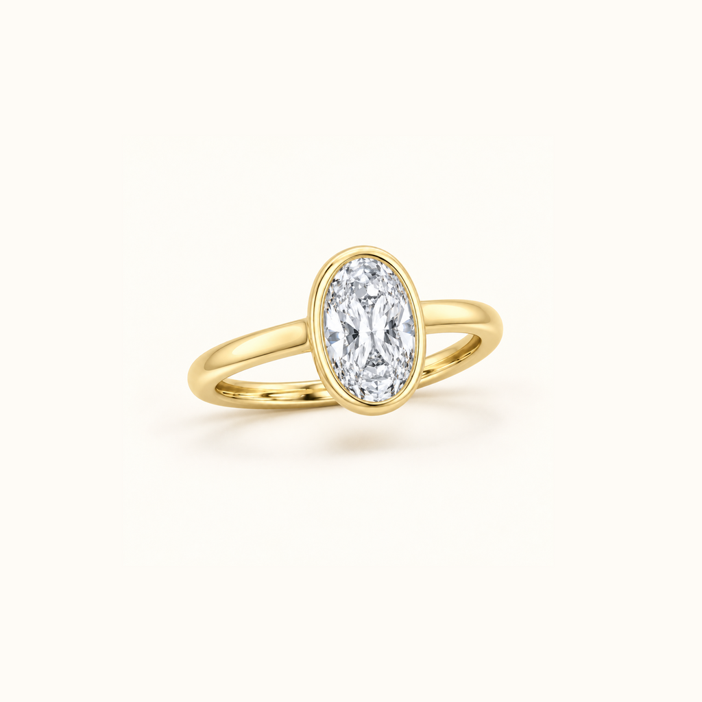 Orbit ring at an angle in 14K yellow gold with a 1ct oval diamond in a smooth bezel setting
variant: yellow-gold