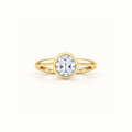 Orbit ring in 14K yellow gold with a 1ct round diamond in a smooth bezel setting
variant: yellow-gold