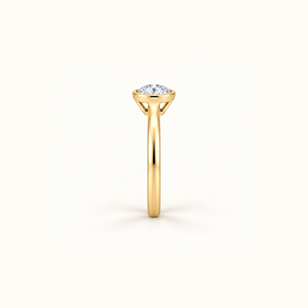Side view of Orbit ring in 14K yellow gold with a 1ct round diamond in a smooth bezel setting
variant: yellow-gold