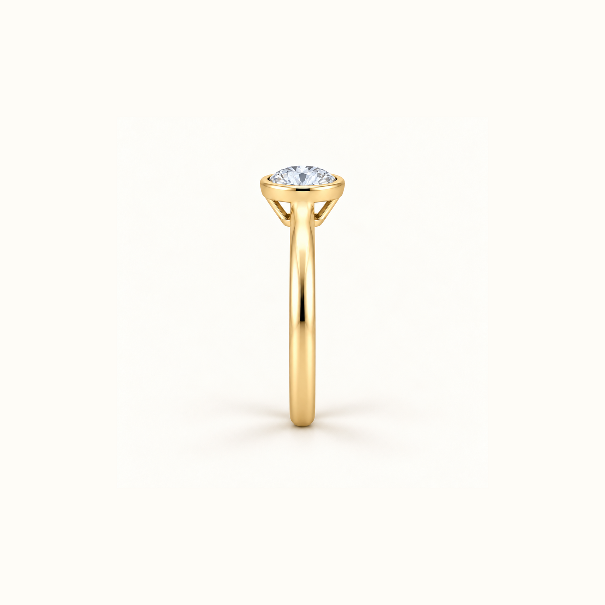 Side view of Orbit ring in 14K yellow gold with a 1ct round diamond in a smooth bezel setting
variant: yellow-gold
