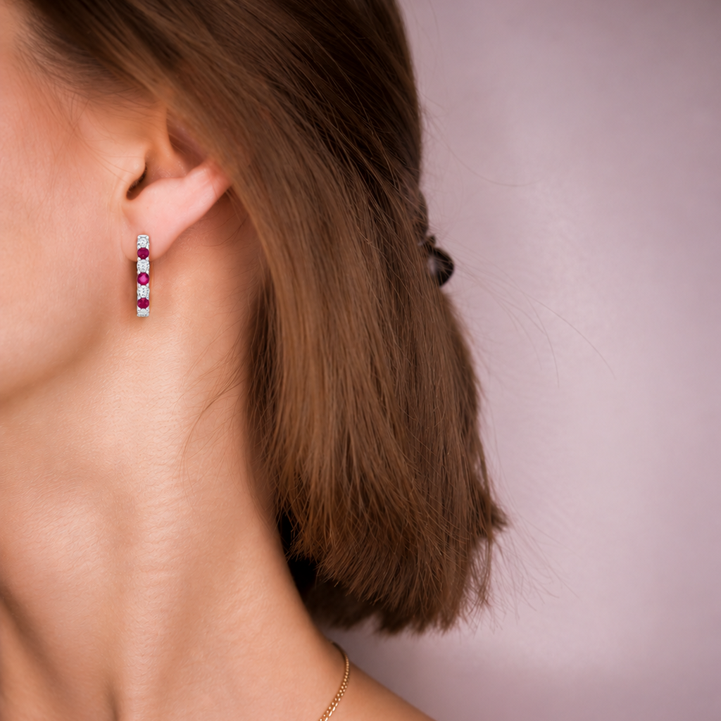 Prism Hoop worn on the ear, lab-created rubies and diamonds lining the front of the hoop
variant: ruby