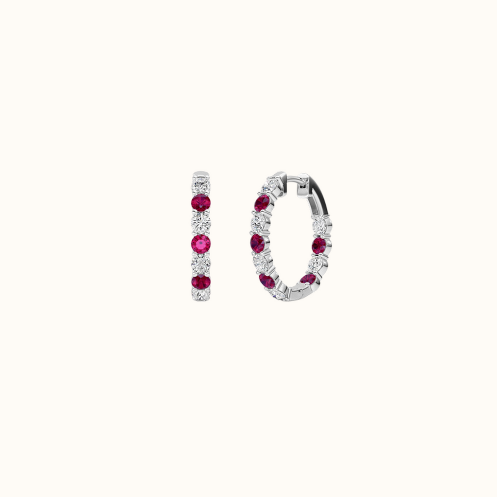 Prism Hoops in 14K white gold, one shown from the front and one turned to show stones set on the inside of the hoop
variant: ruby