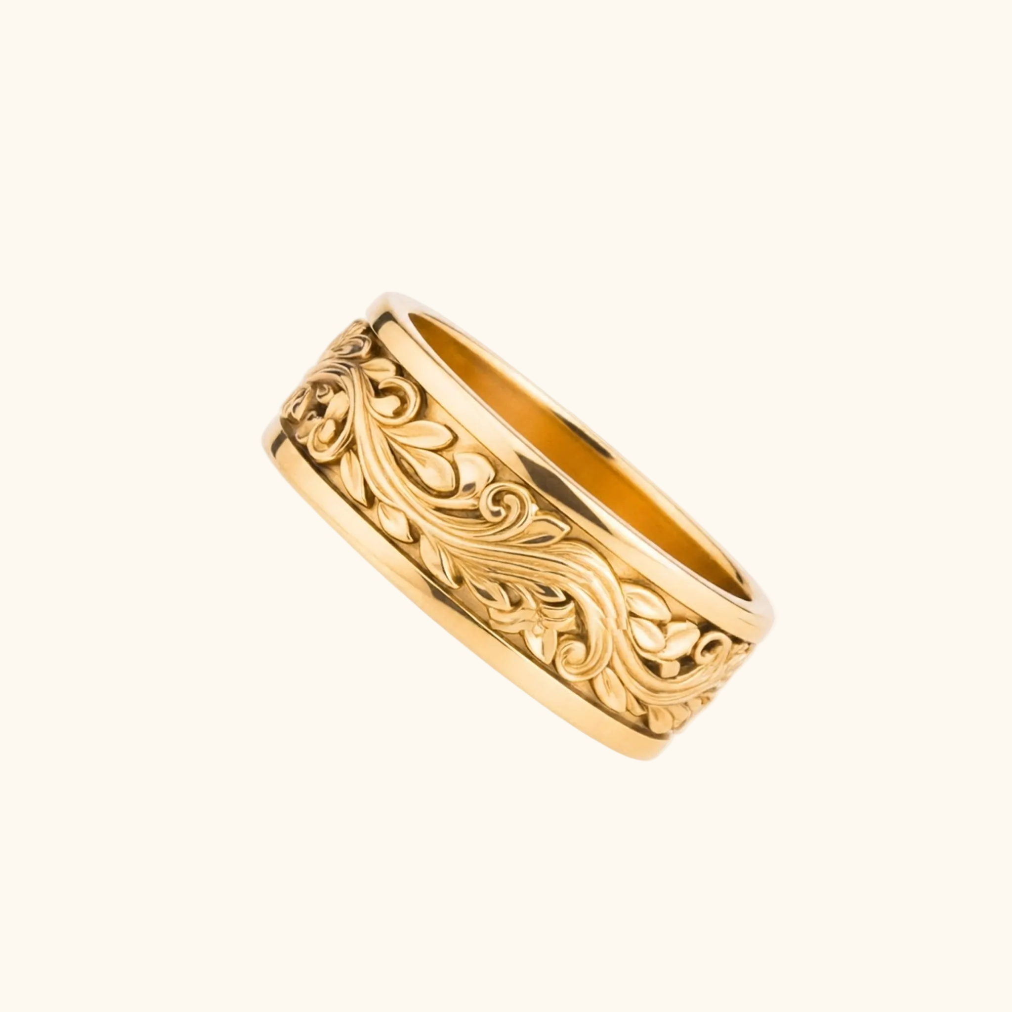 Verona yellow gold band ring featuring an ornate, raised floral and scrollwork pattern, shown on a plain white background.

variant: yellow-gold