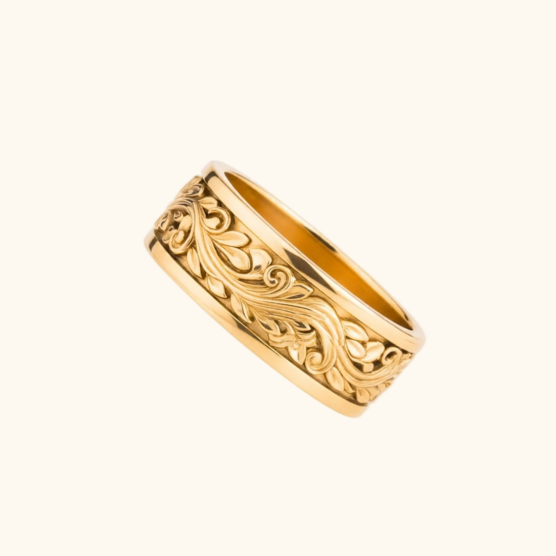 Verona yellow gold band ring featuring an ornate, raised floral and scrollwork pattern, shown on a plain white background.

variant: yellow-gold