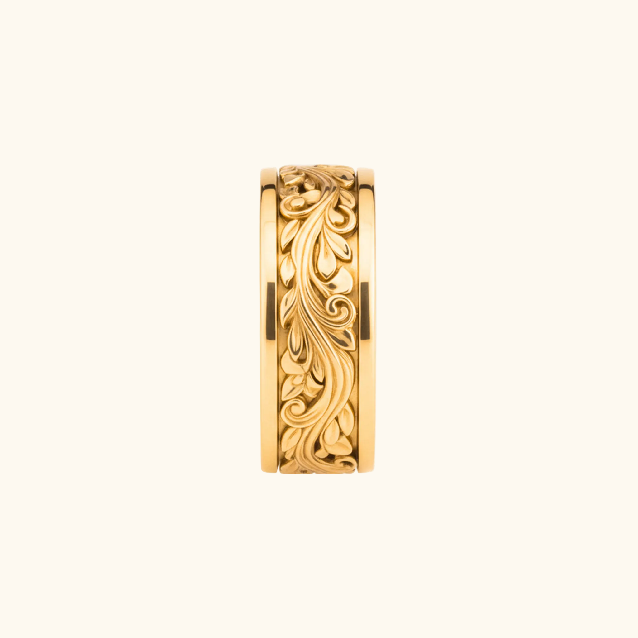 Verona yellow gold ring featuring an intricate, raised floral and leaf scrollwork pattern, shown against a solid white background.

variant: yellow-gold