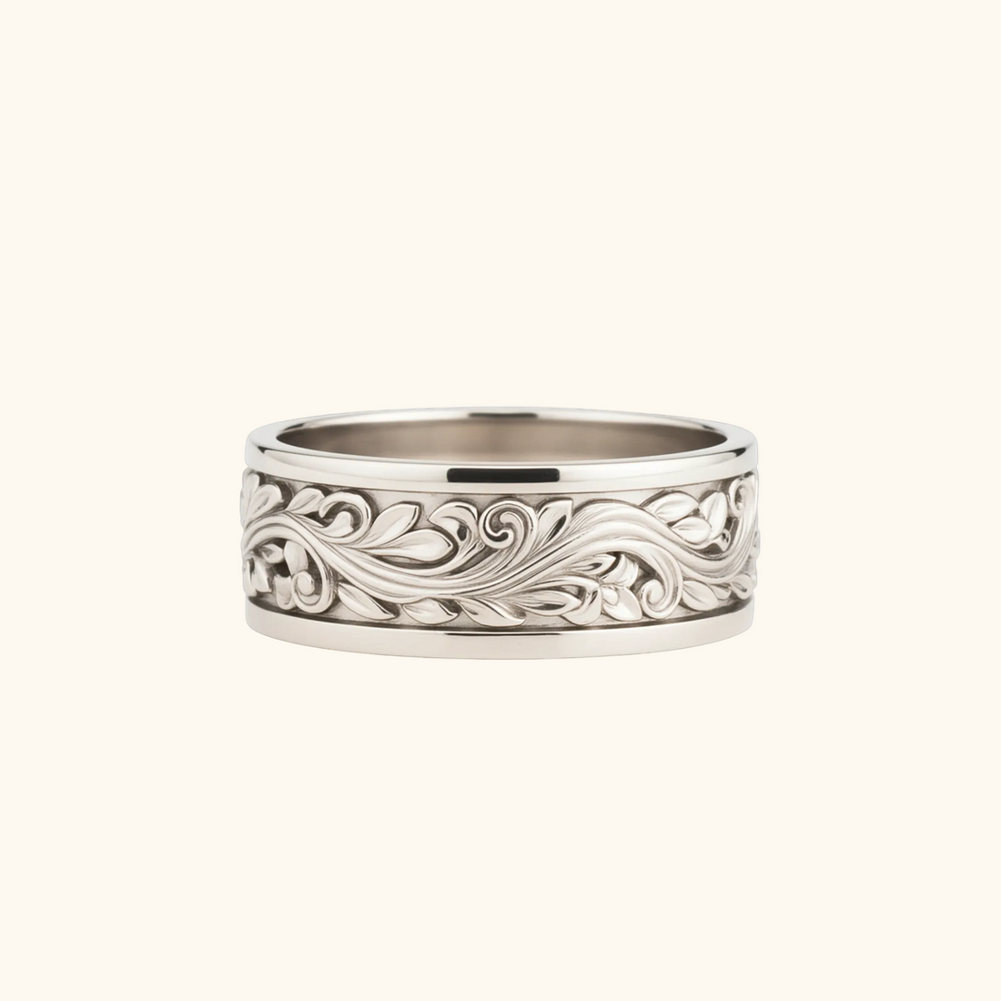 Verona silver ring with an intricate, raised scrollwork pattern around the outer edge, shown on a light cream background.

variant: silver