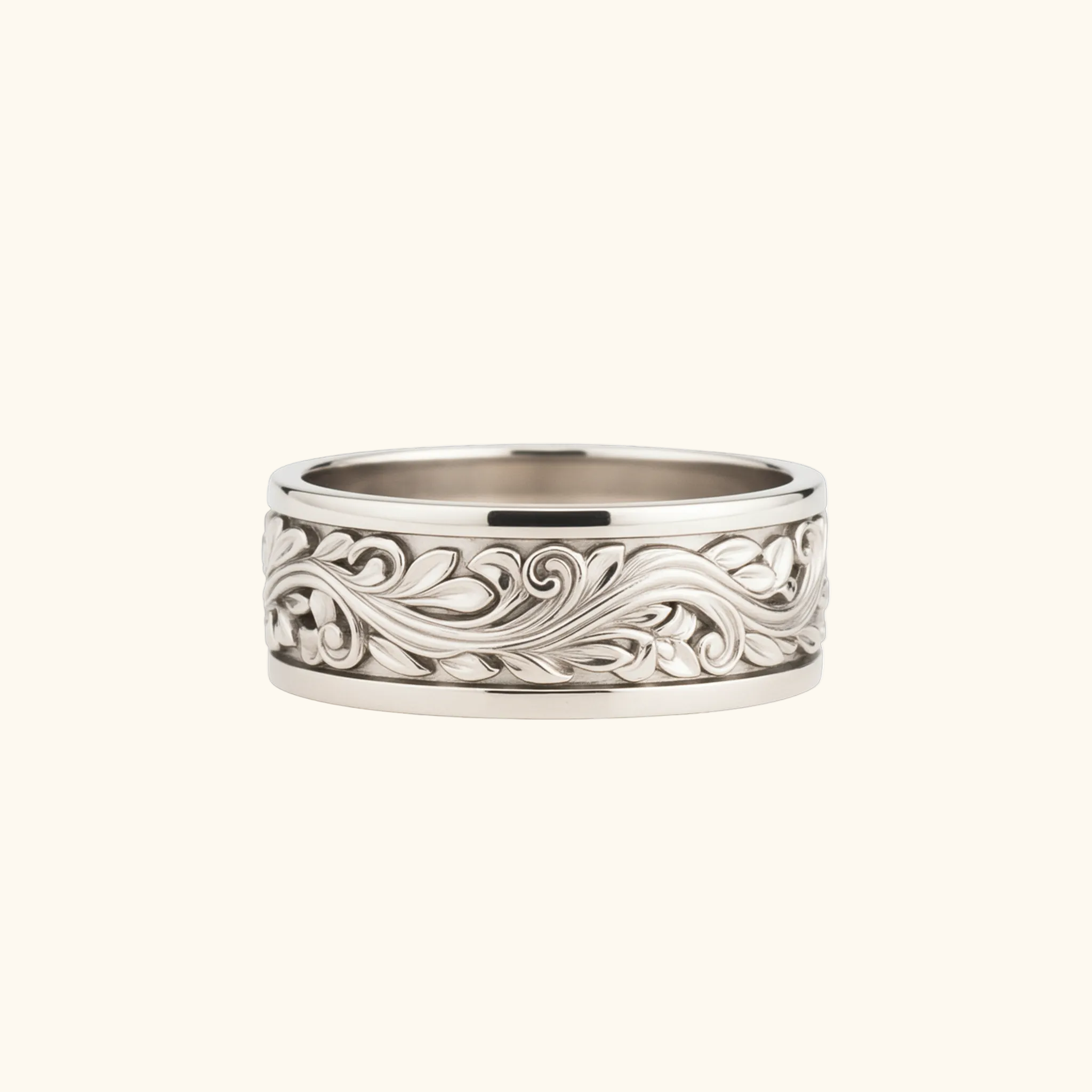 Verona white gold ring with an intricate, raised scrollwork pattern around the outer edge, shown on a light cream background.

variant: white-gold
