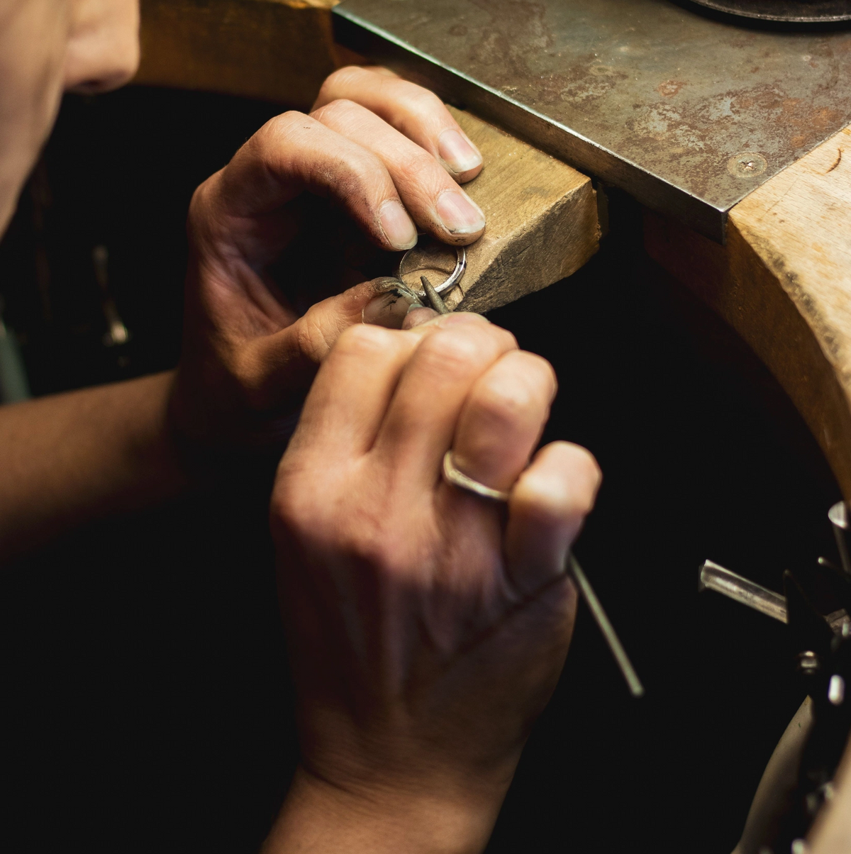 Jeweler finishing a custom ring at the bench